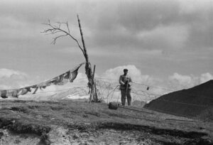 A Chinese soldier guards the border on the Nathu La mountain pass.