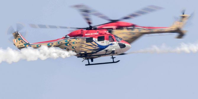 IAF's helicopter display team Sarang performs aerobatic stunts during the 88th Air Force Day parade at Hindon airbase in Ghaziabad.